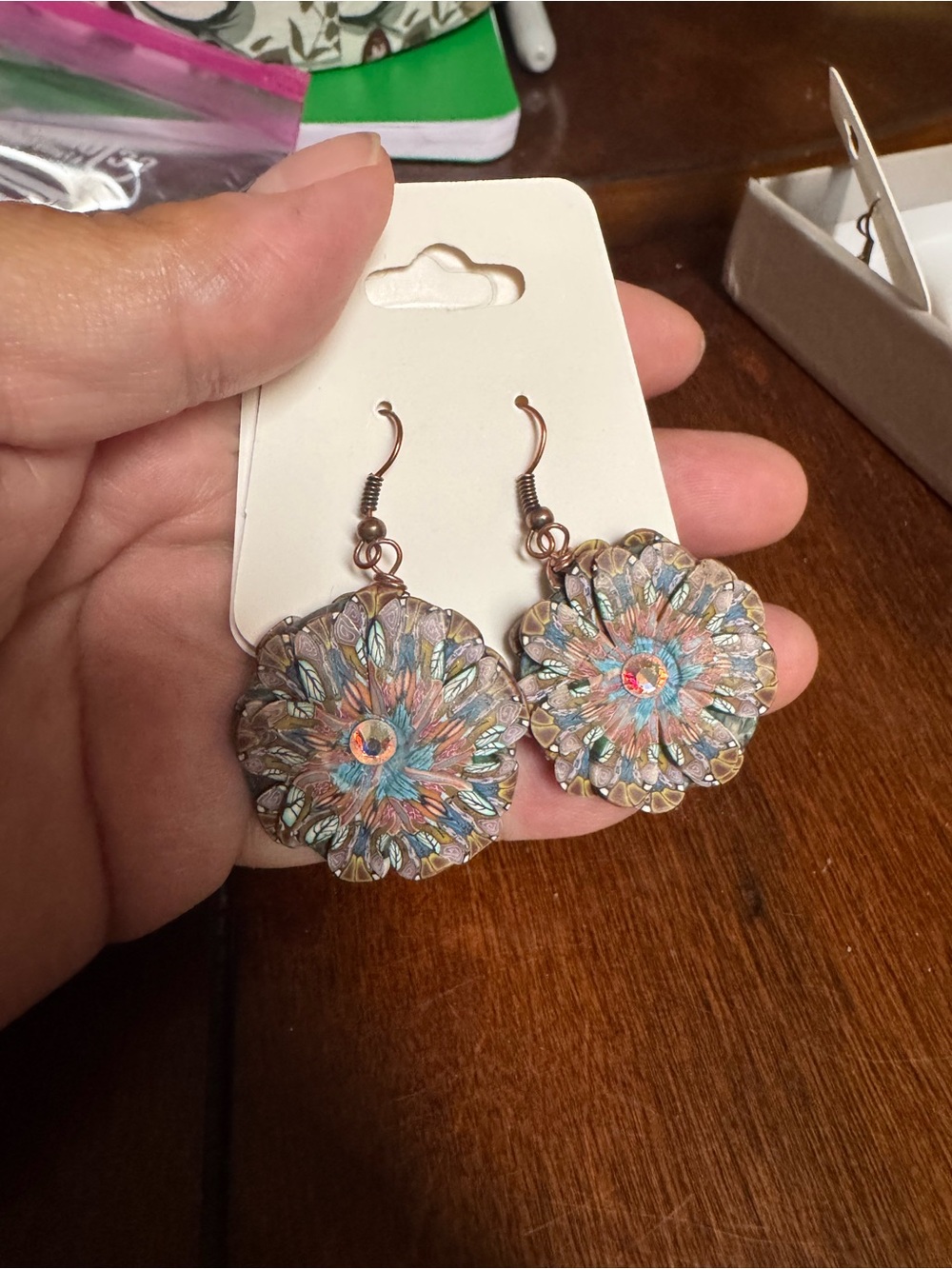 flower-shaped earrings feature intricate patterned petals